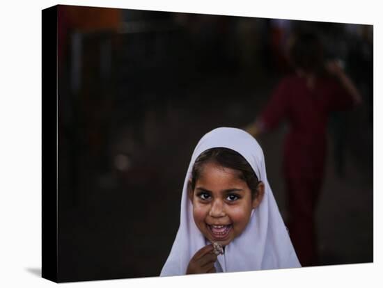 Pakistani Girl Waits for Her Mother to Get Rice During a Donated Food Distribution at the Beri Iman-null-Premier Image Canvas