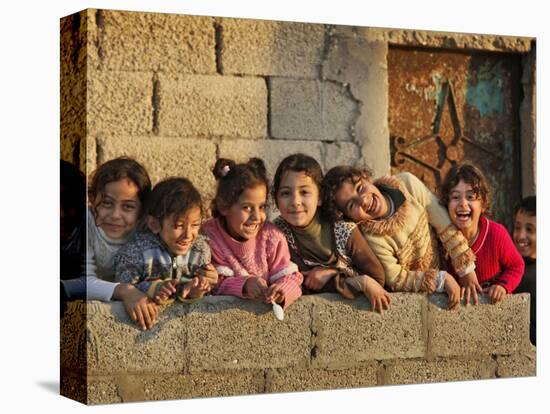 Palestinian Girls Giggle While Photographed Where Shell from an Israeli Gunboat Landed Earlier-null-Premier Image Canvas
