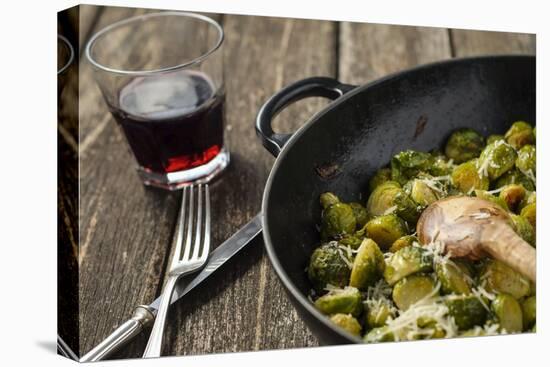 Pan-Fried Brussels Sprouts in Cast-Iron Frying Pan on Wooden Table-Jana Ihle-Premier Image Canvas
