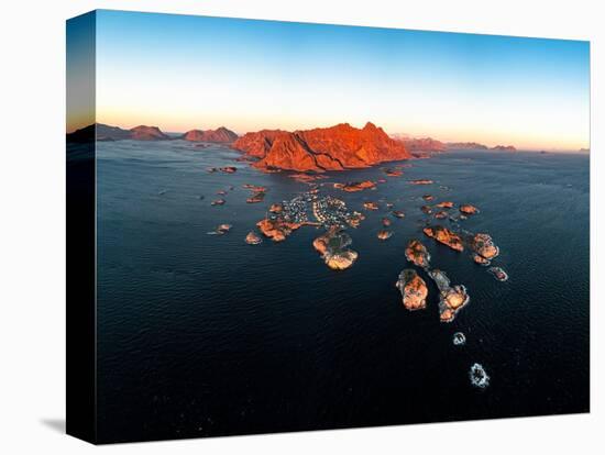 Panoramic aerial view of the fishing village of Henningsvaer and mountains at sunset-Roberto Moiola-Premier Image Canvas