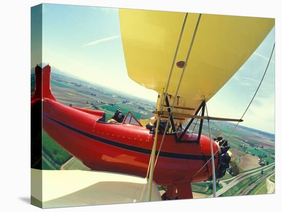 Passenger and Pilot in Biplane over Tulip Fields, Skagit Valley, Washington, USA-Stuart Westmoreland-Premier Image Canvas