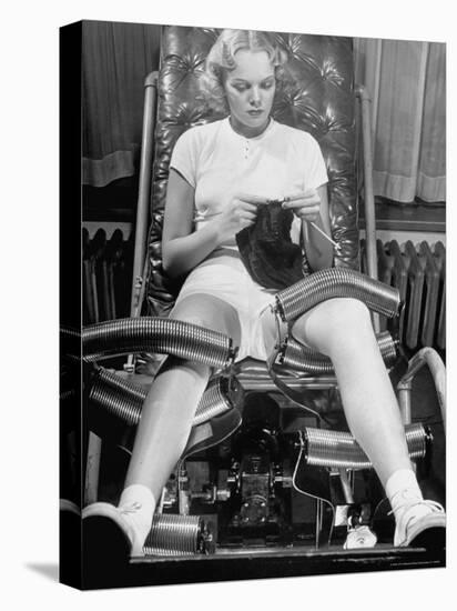 Pat Ogden at Slenderizing Salon Knitting in Padded Chair While Leg Rollers Work from Thigh to Ankle-Alfred Eisenstaedt-Premier Image Canvas