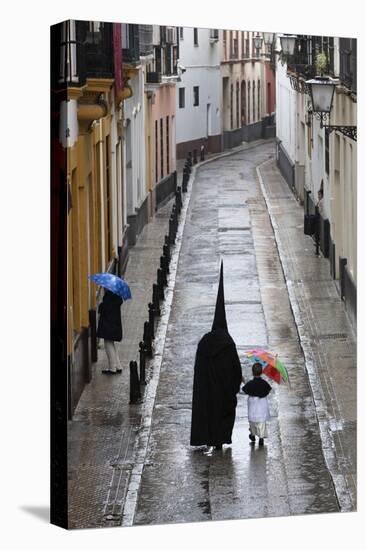 Penitents During Semana Santa (Holy Week) Along Rainy Street, Seville, Andalucia, Spain, Europe-Stuart Black-Premier Image Canvas