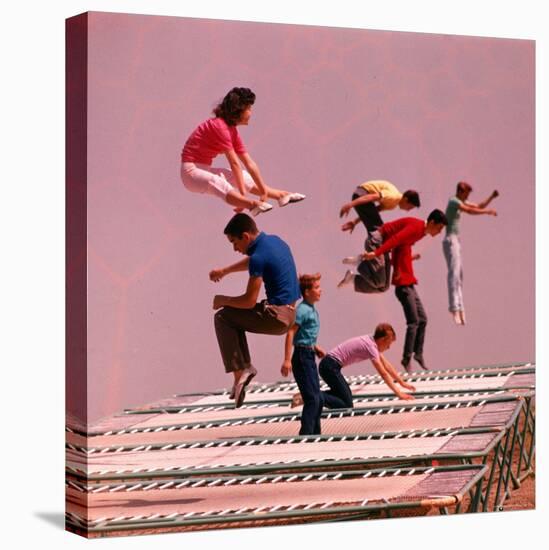 People Bouncing on Trampolines at Trampoline Center-J^ R^ Eyerman-Premier Image Canvas