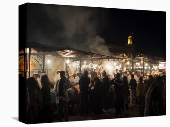 People eating at one of the stalls in Jemaa el-Fna at night, Marrakesh, Morocco-null-Premier Image Canvas