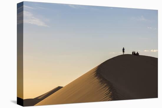 People in silhouette on Khongor sand dunes in Gobi Gurvan Saikhan National Park, Sevrei district, S-Francesco Vaninetti-Premier Image Canvas