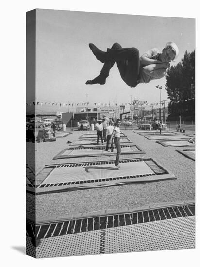 People Jumping on Trampolines-Ralph Crane-Premier Image Canvas