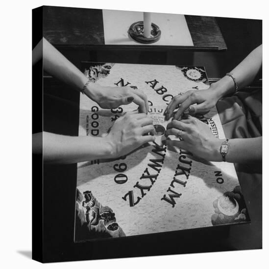 People Playing with a Ouija Board-null-Premier Image Canvas