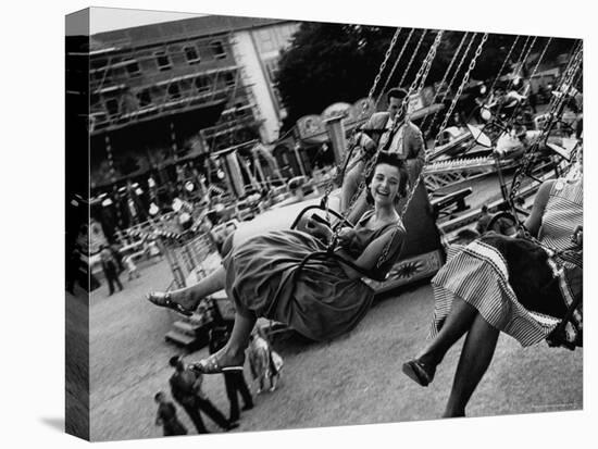 People Riding a Merry Go Round, During the Celebration of Munich's 800th Anniversary-Michael Rougier-Premier Image Canvas