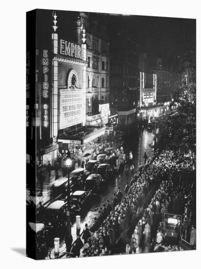 People Waiting in Front of the Brightly Lighted Empire Theatre for the Royal Film Performance-Cornell Capa-Premier Image Canvas