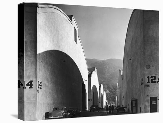 People Walking Between Sound Stages at Warner Brothers Studio-Margaret Bourke-White-Premier Image Canvas