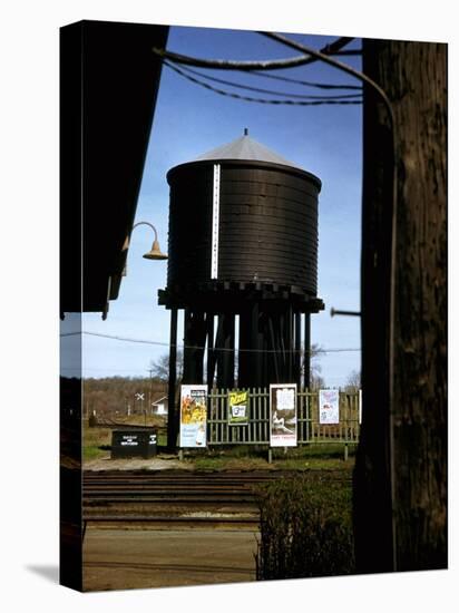 Photo Taken from Window of a Train Showing Water Storage Tower Beside Tracks-Walker Evans-Premier Image Canvas