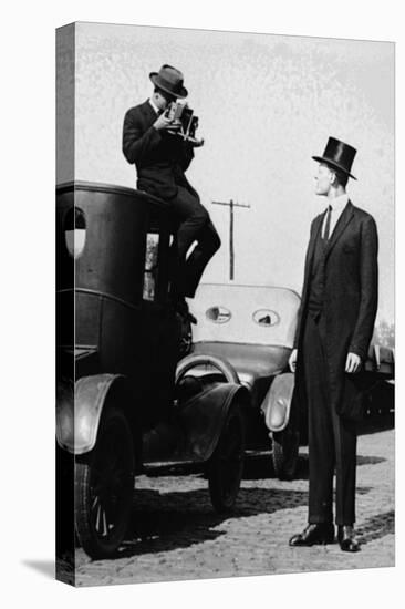 Photographer Mounts Himself on Roof of a Car to Shoot a Pictures of Exceedingly Tall Men in Top Hat-null-Stretched Canvas