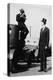 Photographer Mounts Himself on Roof of a Car to Shoot a Pictures of Exceedingly Tall Men in Top Hat-null-Stretched Canvas