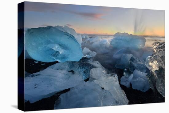 Pieces of glacial ice over black sand being washed by waves, Iceland-Raul Touzon-Premier Image Canvas