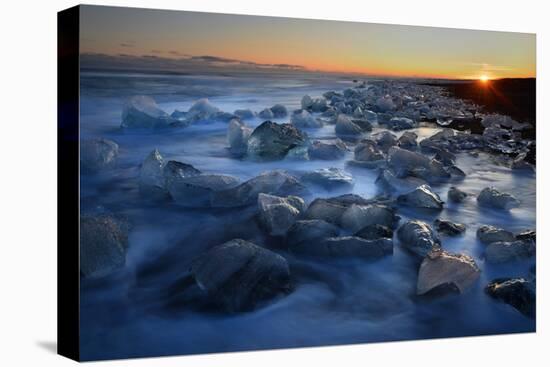 Pieces of glacial ice over black sand being washed by waves, Iceland-Raul Touzon-Premier Image Canvas