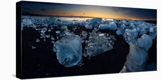 Pieces of glacial ice over black sand being washed by waves, Iceland-Raul Touzon-Premier Image Canvas