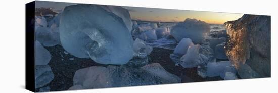 Pieces of glacial ice over black sand being washed by waves, Iceland-Raul Touzon-Premier Image Canvas