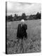 Poet Robert Frost Standing in Oxford Field with His Hand over His Face-Howard Sochurek-Premier Image Canvas