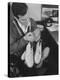 Pop Singer Pat Boone Autographing His White Buck Leather Shoes for Charity-Ralph Morse-Premier Image Canvas