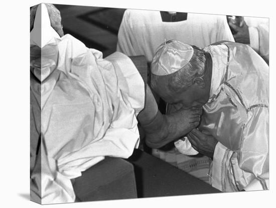 Pope John Paul II Kisses the Feet of One of 12 Mentally Retarded Italians-null-Premier Image Canvas