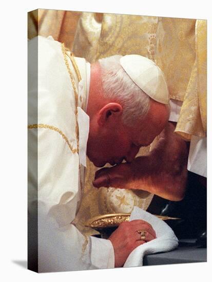 Pope John Paul II Kisses the Foot of a Clergyman-null-Premier Image Canvas