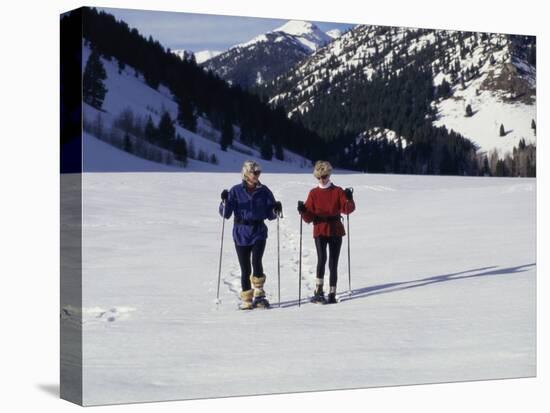 Portrait of a Senior Woman and a Young Woman Standing Wearing Skis-null-Premier Image Canvas