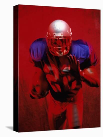 Portrait of an American Football Player Standing in a Tackle Pose-null-Premier Image Canvas