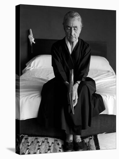 Portrait of Artist Georgia O'Keeffe Holding a Book by Leonard Baskinin Her Bedroom-John Loengard-Premier Image Canvas