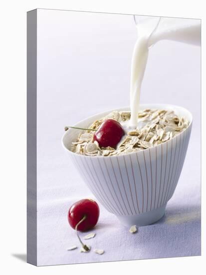 Pouring Milk onto Oat Flakes-null-Premier Image Canvas