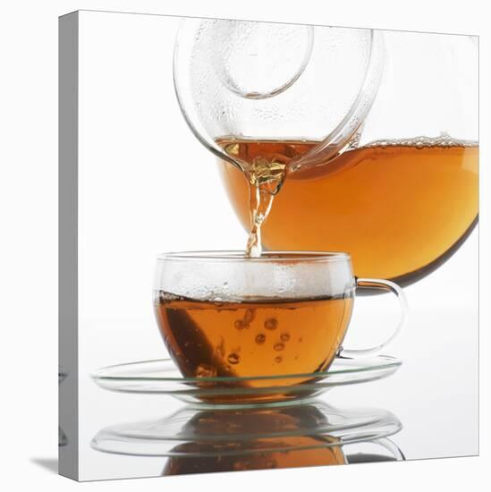 Pouring Tea into a Glass Cup-Alexander Feig-Premier Image Canvas