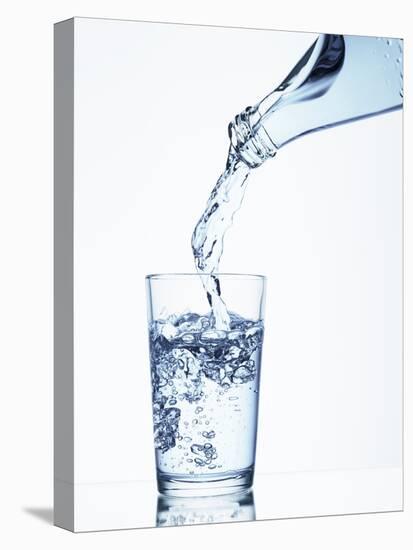 Pouring Water from a Bottle into a Glass-Petr Gross-Premier Image Canvas