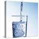 Pouring Water into a Glass-Kai Schwabe-Premier Image Canvas