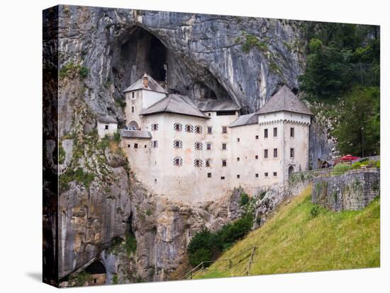 Predjama, Inner Carniola, Slovenia. Predjama Castle, built into the opening of a cave.-null-Premier Image Canvas