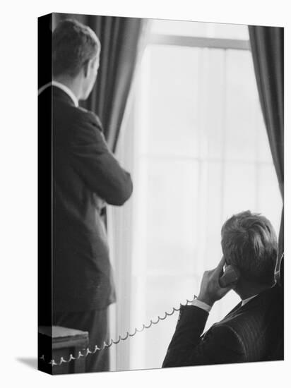 Pres. John F. Kennedy on Telephone While Brother, Attorney General Robert F. Kennedy Stands Nearby-Art Rickerby-Premier Image Canvas