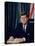 Pres. John F. Kennedy Sitting at His Desk, with Flag in Bkgrd-Alfred Eisenstaedt-Premier Image Canvas