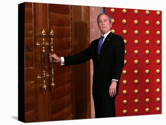 President George W. Bush as He Tries to Open a Locked Door Leaving a Press Conference in Beijing-null-Premier Image Canvas