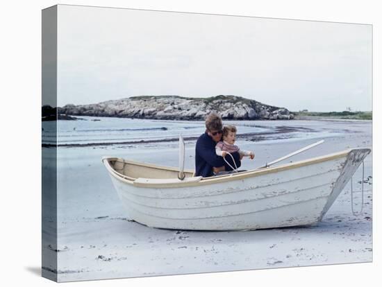 President John Kennedy and John Jr. Play in a Beached Rowboat at Newport, Rhode Island. 1962-null-Stretched Canvas