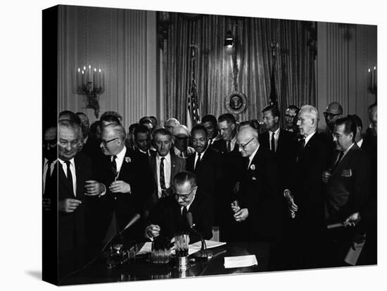 President Lyndon Johnson, Watched by Martin Luther King, Jr. Signing Civil Rights Act, July 2, 1964-null-Stretched Canvas