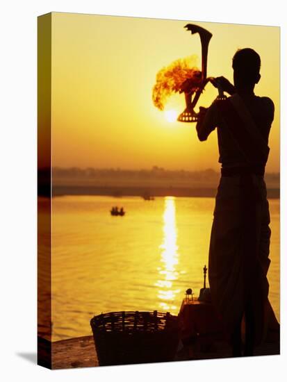 Priest Moves Lantern in Front of Sun During Morning Puja on Ganga Ma, Varanasi, India-Anthony Plummer-Premier Image Canvas