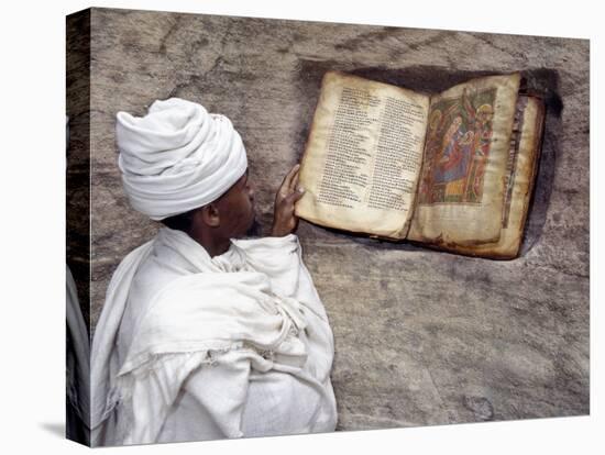 Priest of Ethiopian Orthodox Church Reads Old Bible at Rock-Hewn Church of Yohannes Maequddi-Nigel Pavitt-Premier Image Canvas