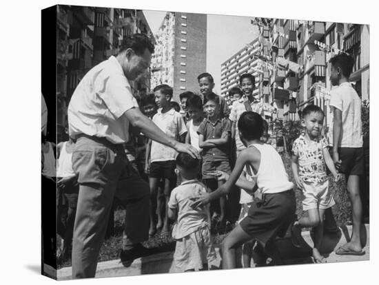 Prime Minister Kuan Yew Lee Talking to Children While Visiting a Housing Project-null-Premier Image Canvas