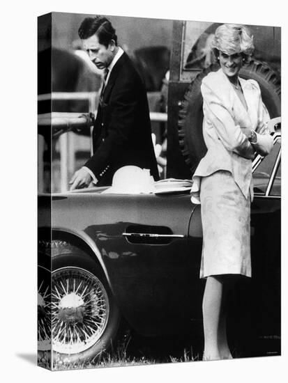 Prince Charles Examining the Bodywork of His Aston Martin-null-Premier Image Canvas