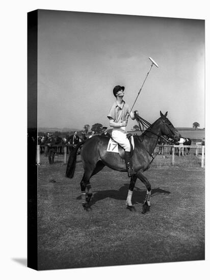 Prince Philips Rides Along on Horseback Holding Polo Stick During Game-null-Premier Image Canvas