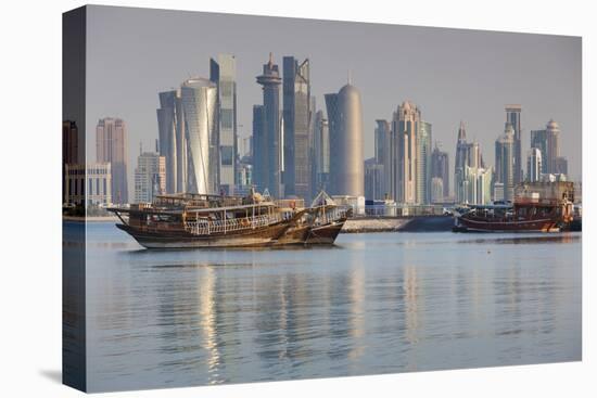 Qatar, Doha, Dhows on Doha Bay with West Bay Skyscrapers, Dawn-Walter Bibikow-Premier Image Canvas