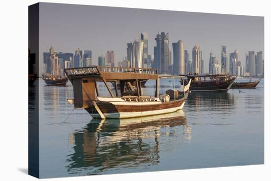 Qatar, Doha, Dhows on Doha Bay with West Bay Skyscrapers, Dawn-Walter Bibikow-Premier Image Canvas