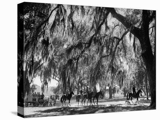 Quail Hunters Riding on Horseback-Ed Clark-Premier Image Canvas