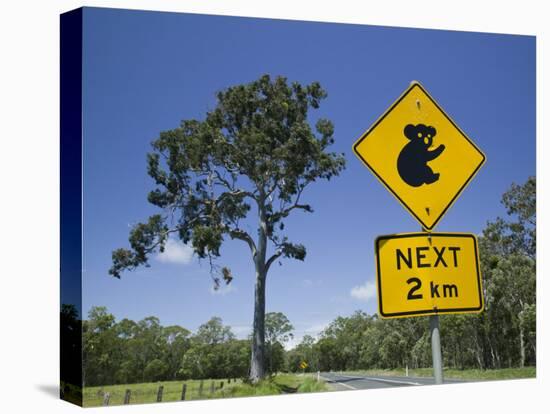 Queensland, Fraser Coast, Maryborough, Koala Crossing Sign on the Bruce Highway, Australia-Walter Bibikow-Premier Image Canvas