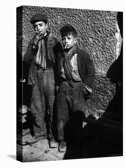 Ragged, Filthy, Poverty Stricken, Street Boys Smoking Cigarettes Begged from American Soldiers-George Rodger-Premier Image Canvas