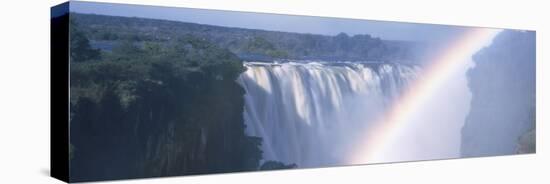Rainbow over a Waterfall, Victoria Falls, Zambezi River, Zimbabwe-null-Stretched Canvas